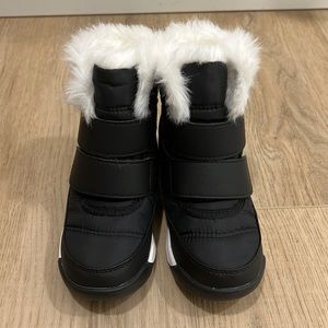 Brand New (without tags) Sorel snow boots. They are black with white fur.